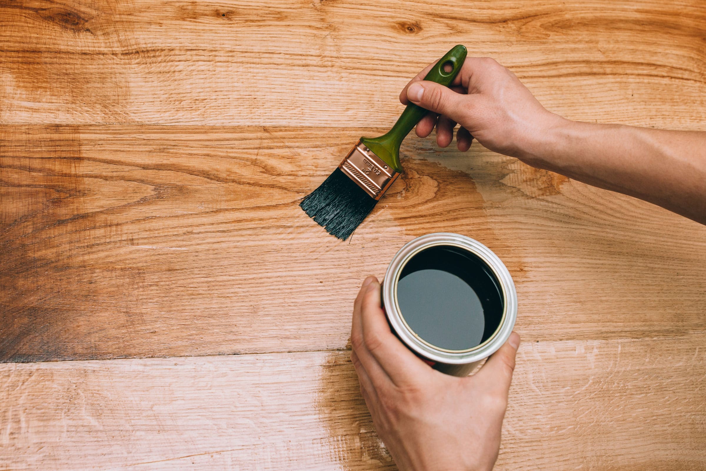 Varnish being applied to wood